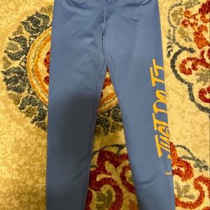 Brand NWT Women’s NIKE ONE blue leggings with orange writing LARGE